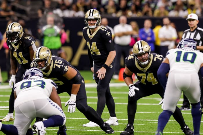 New Orleans, Louisiana, USA; New Orleans Saints quarterback Andy Dalton (14) looks over the Seattle Seahawks defense. Mandatory Credit: Stephen Lew-USA TODAY Sports